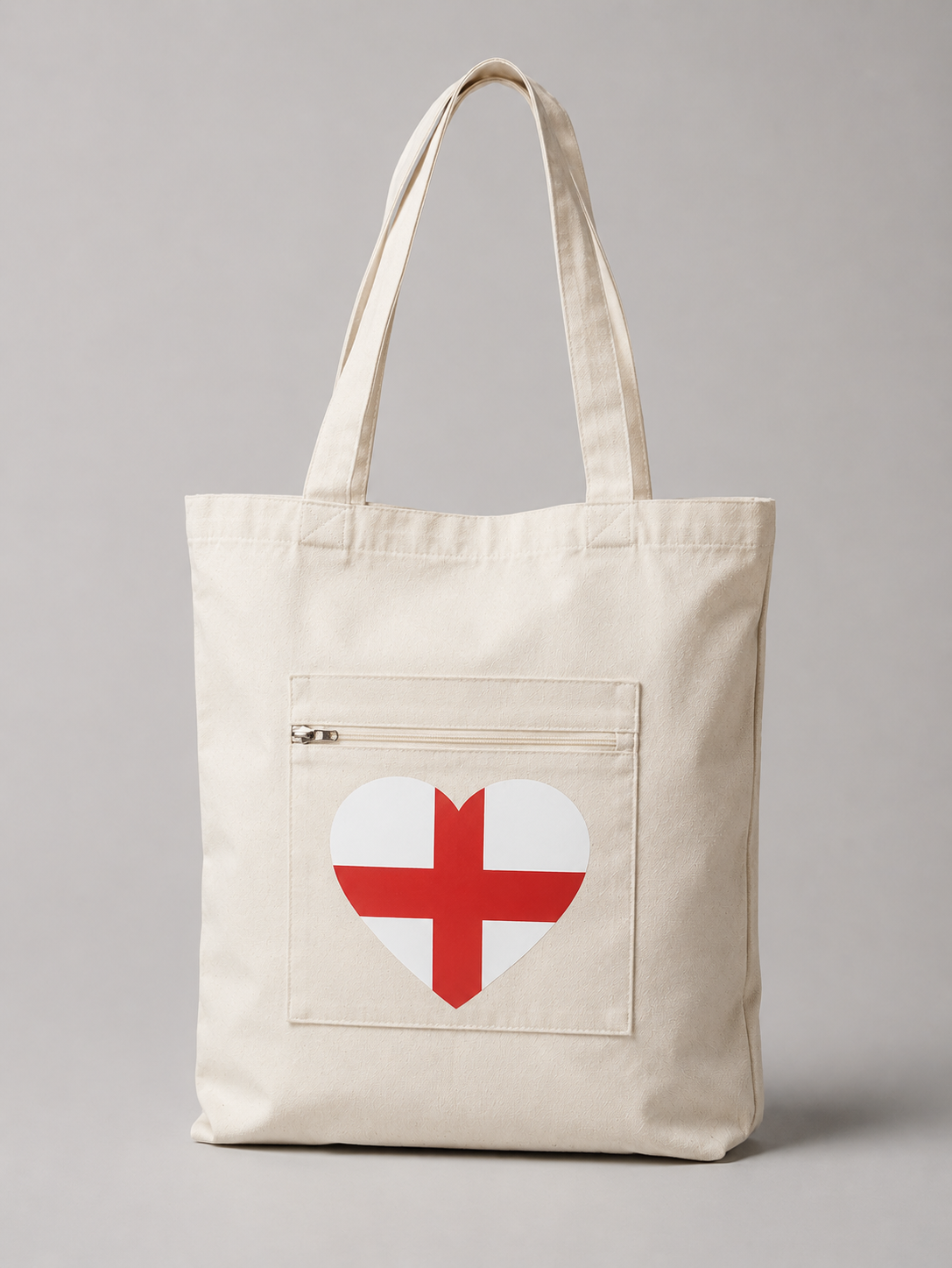 Katoenen tote bag met hartvormige Engeland-vlag bedrukking en handig voorvak met ritssluiting, duurzame canvas shopper voor dagelijks gebruik, reizen en evenementen.